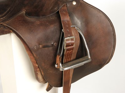 Lot 597 - Military leather horse saddle, with stirrups