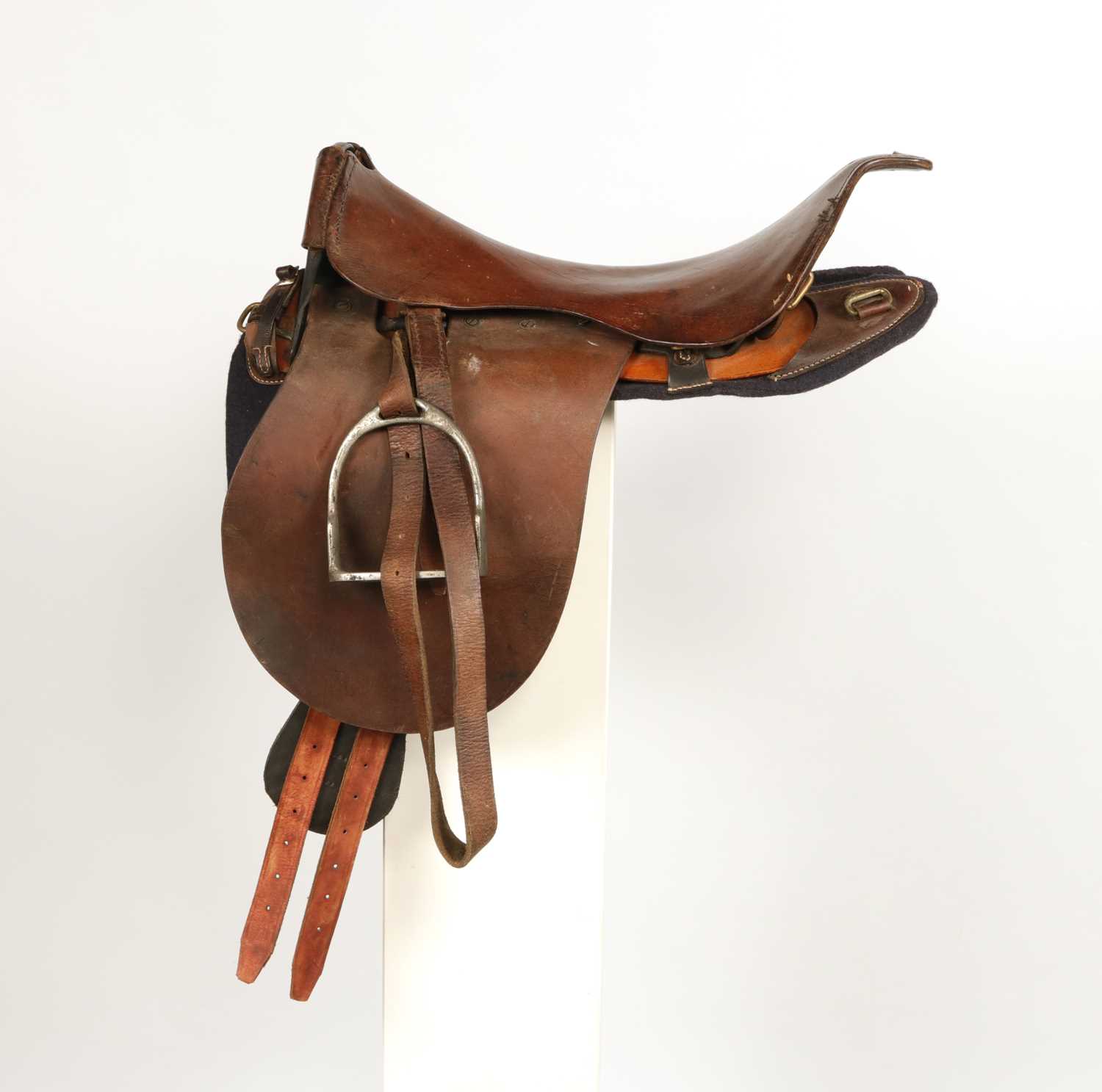 Lot 599 - Military leather horse saddle, with stirrups