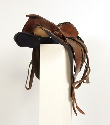 Lot 599 - Military leather horse saddle, with stirrups