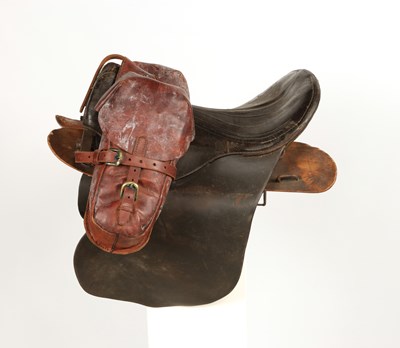 Lot 615 - Military leather horse saddle, with stirrups and saddlebags