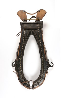 Lot 682 - Leather and wood horse collar harness, decorated with studs