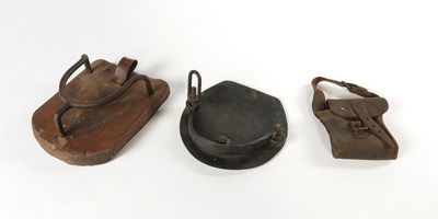 Lot 703 - Two antique horse shoes and a leather bag