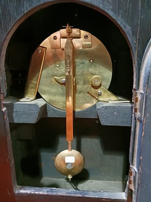 Lot 1141 - A wooden table clock with a brass dial