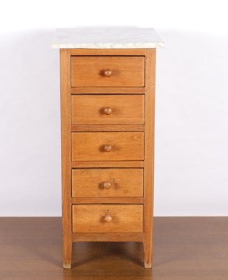 Lot 1244 - Light oak chest of drawers with marble top