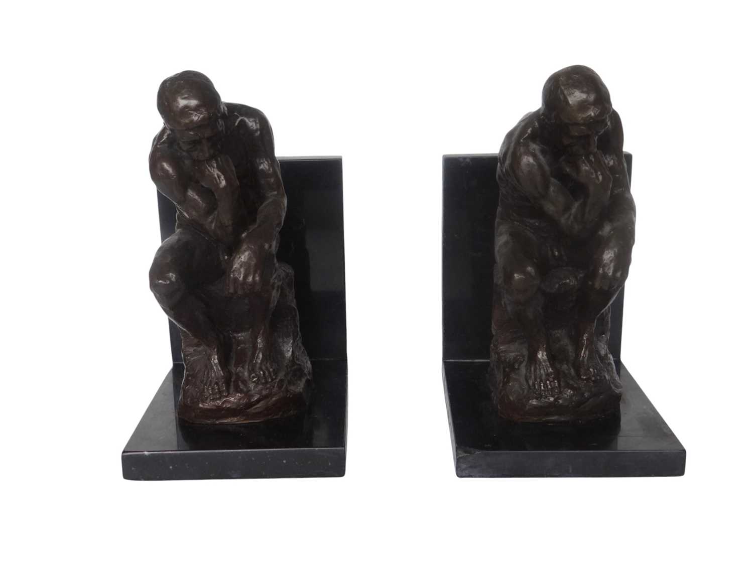 Lot 25 - 2 Bronzen boekensteunen "De Denker" after Rodin