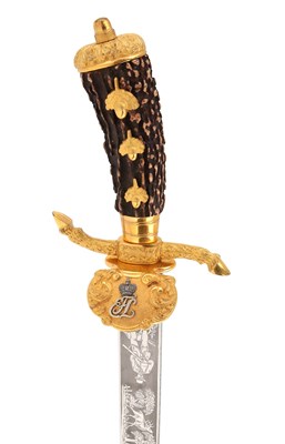 Lot 104 - A ROYAL GILT PRESENTATION HUNTING HANGER
